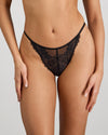 Model wears Midnight Magic Thong in BLACK. On body front view