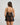 Model wears Oasis Glow Babydoll in BLACK. On body back view