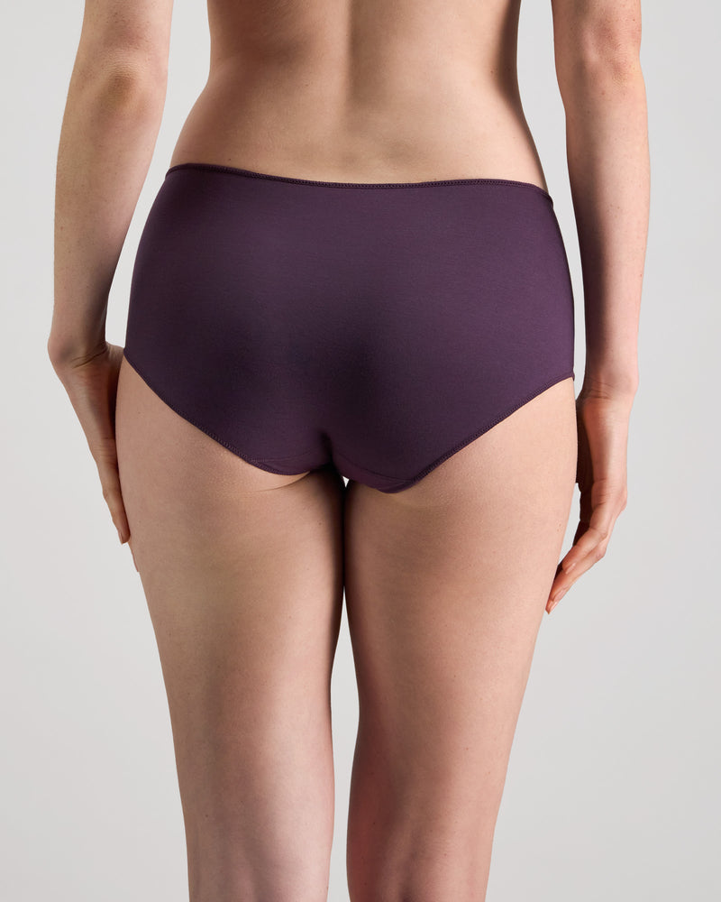 Model wears Au Naturel Full Brief in PLUM PERFECT. On body back view