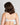 Model wears Embrace Contour Bra in LUNAR ROCK MARLE. On body back view