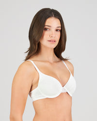 Model wears Angelica Contour Bra in WHITE. On body side view