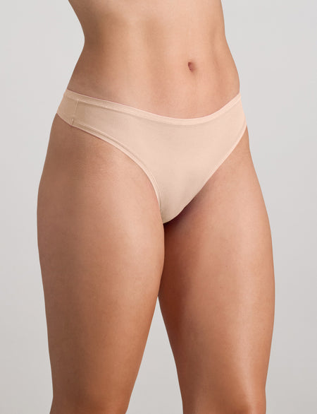 Model wears Extra-Ordinary Thong in LATTE. On body side view