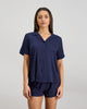 Model wears Belle Bamboo Short Pj Set in NAVY BLAZER. On body front view
