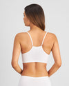 Model wears Simply Seamless Crop Top in WHITE. On body back view