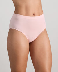 Model wears Seamless Soft Full Brief in ICY PINK. On body side view