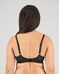 Model wears Magnetism Underwire Bra in BLACK/LATTE. On body back view