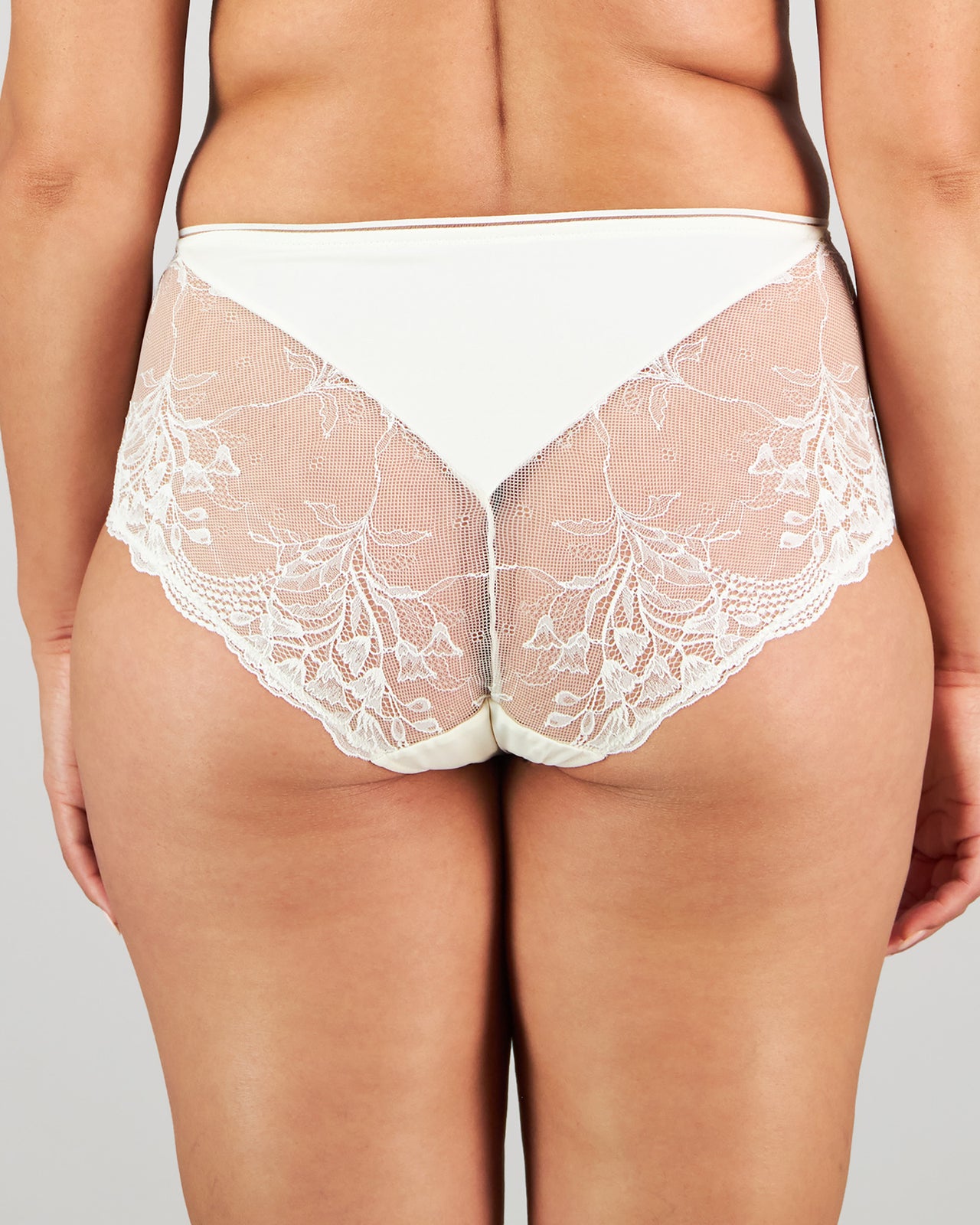 Model wears Dreamscape Full Brief in EGRET. On body back view