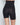 Model wears Bamboo Bodywear High Waisted Shaper Short in BLACK. On body back view