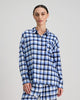 Model wears Cosy Flannel Long Sleeve PJ Top in BLUE CHECK. On body front view
