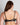 Model wears Daring Underwire Bra in BLACK. On body back view