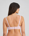 Model wears Comfit Collection Wire Free Bra in FESTIVAL BLOOM. On body back view