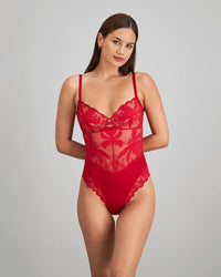Model wears Margot Estelle Bodysuit in JESTER RED. On body front view