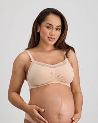 Model wears Bendon Nurture Maternity Bra in LATTE. On body front view