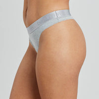 Model wears Cotton Logo Thong in GREY MARL. On body side view