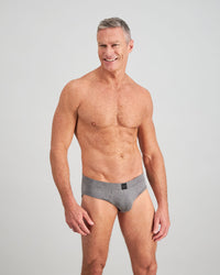 Model wears High Tech Cotton Mens Brief in GREY MARL. On body side view