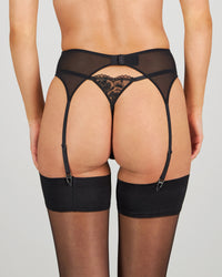 Model wears Romilly Suspender in BLACK. On body back view