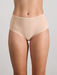 Model wears Extra-Ordinary Full Brief in LATTE. On body front view