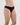 Model wears Cotton And Lace Bikini in BLACK. On body side view