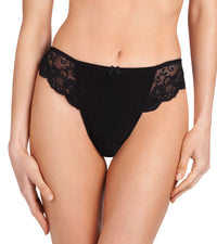 Model wears Body Lace Thong in BLACK. On body front view