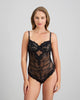 Model wears My Fit Lace Bodysuit in BLACK. On body front view