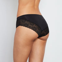 Model wears Lace Trim Brazilian in BLACK. On body back view
