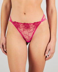 Model wears Heritage Bloom Thong in FANTASY FUCHSIA. On body front view