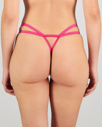 Model wears Heritage Bloom Thong in FANTASY FUCHSIA. On body back view
