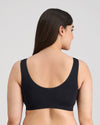 Model wears Bendon Essentials Crop Top in BLACK. On body back view