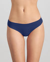 Model wears Seamless Soft Thong in Medieval Blue. On body front view