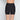 Model wears Everyday Light Hold Chafer Short in BLACK. On body back view