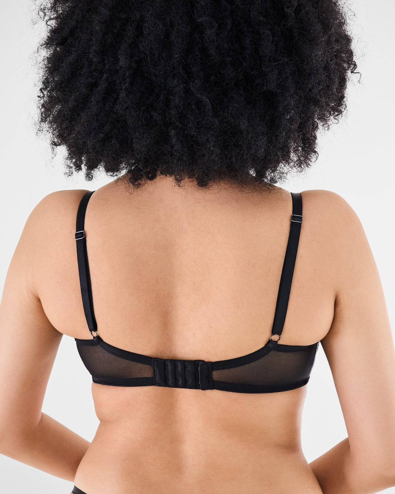 Model wears Romilly Underwire Bra in BLACK. On body back view