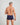 Model wears High Tech Cotton Mens Trunk in PEACOAT. On body back view