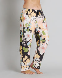 Model wears Mihika Sleeping Long PJ Pant in MID-SUMMER PRINT. On body side view