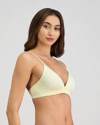 Model wears Simply Seamless Wire Free Bra in TRANSPARENT YELLOW. On body side view