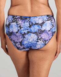 Model wears Wild Violet Full Brief in BLUE HYDRANGEA PRINT. On body back view