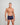 Model wears High Tech Cotton Mens Trunk in PEACOAT. On body side view