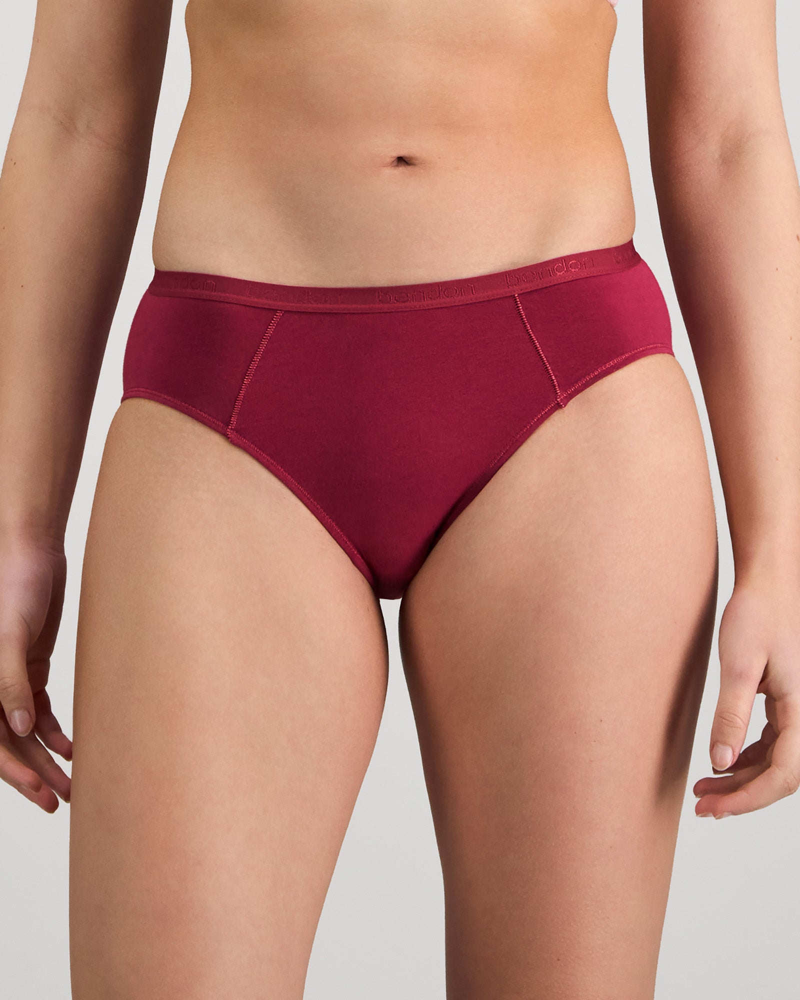 Model wears Body Cotton Bikini in BEAUJOLAIS. On body front view