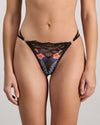 Model wears Adaline Thong in BLACK FLORAL PRINT. On body front view
