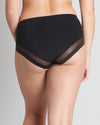 Model wears Comfit Collection Midi in BLACK. On body back view