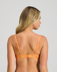 Model wears My Fit Underlayer Underwire Bra in TANGERINE. On body back view