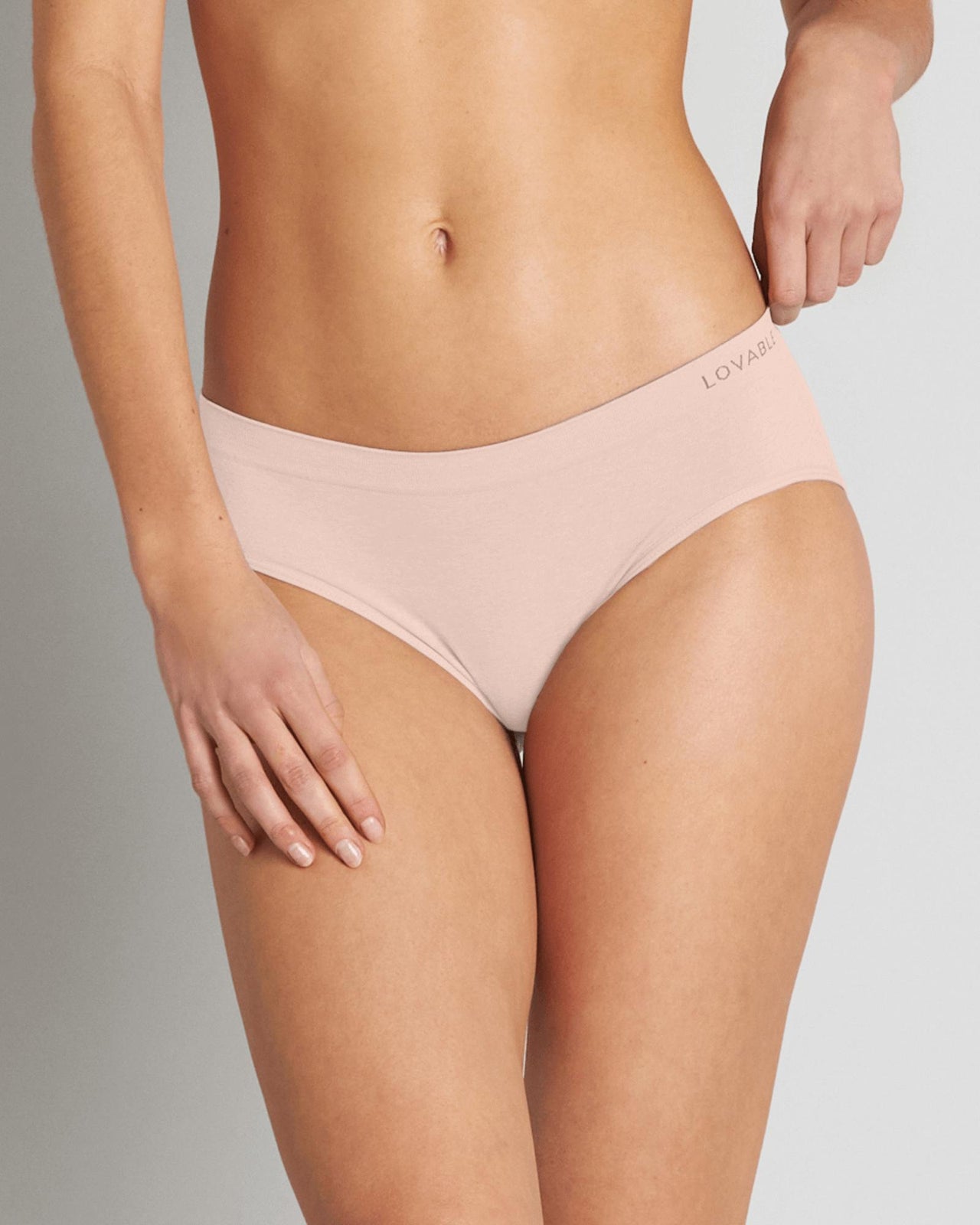 Model wears Simply Seamless Boyshort in SILVER PINK. On body front view