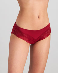 Model wears Lace Trim Brazilian in BIKING RED. On body side view