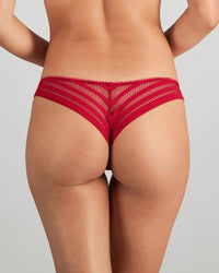 Model wears Morning Lola Thong in JESTER RED. On body back view