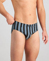 Model wears Cotton Stretch Mens Brief in AQUIFER/BLACK STRIPE. On body side view