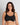 Model wears Power Underwire Bra in BLACK. On body front view