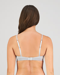 Model wears Simply Seamless Contour Bra in GREY MARL/WHITE STRIPE. On body back view