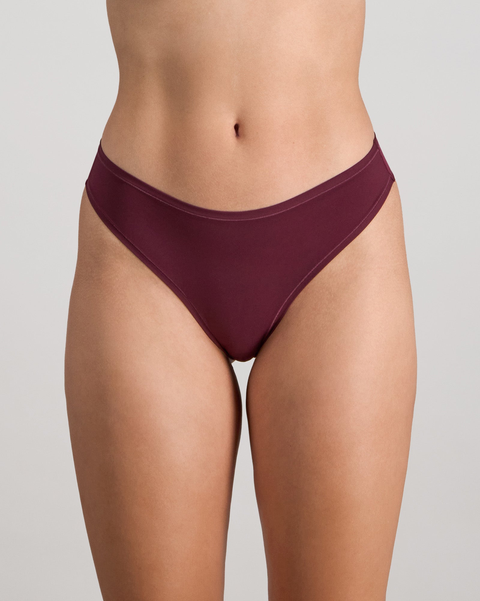 Model wears Extra-Ordinary Thong in FIG. On body front view