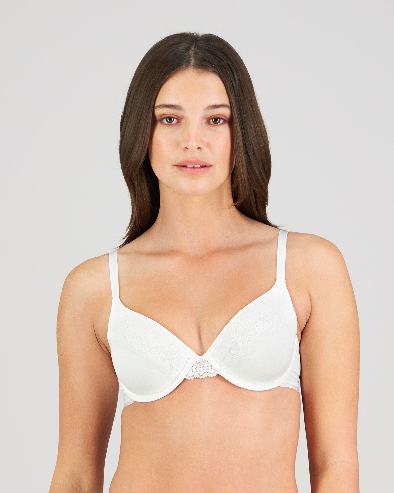 Model wears Angelica Contour Bra in WHITE. On body front view