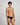 Model wears Cotton Texture Mens Brief in BLACK. On body side view