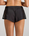 Model wears Lace Impact Short in BLACK. On body back view